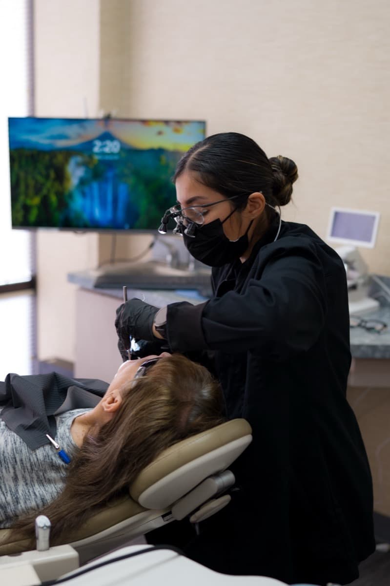 Melisa performing a professional teeth cleaning at Buchwald Family Dentistry