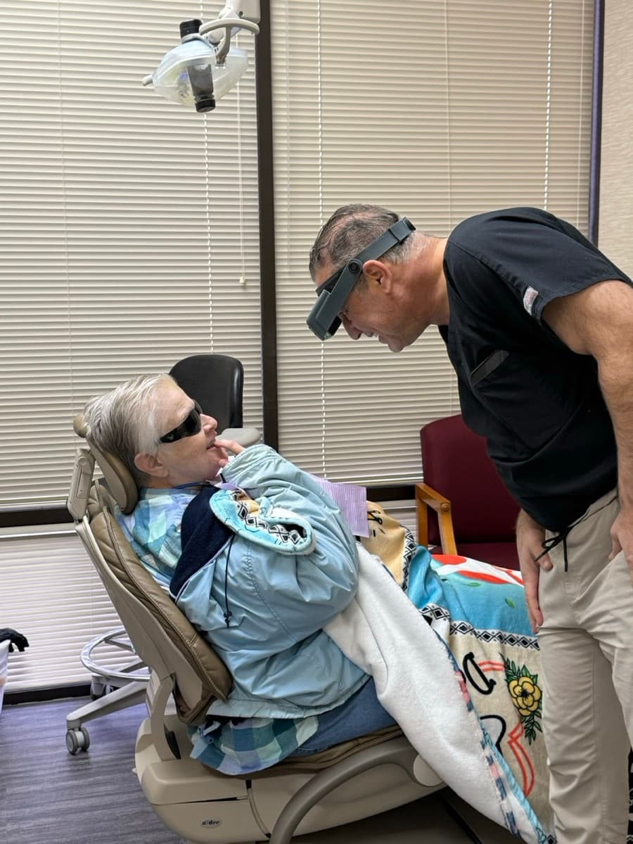 Dr. Buchwald performing custom crown staining for a patient at Buchwald Family Dentistry